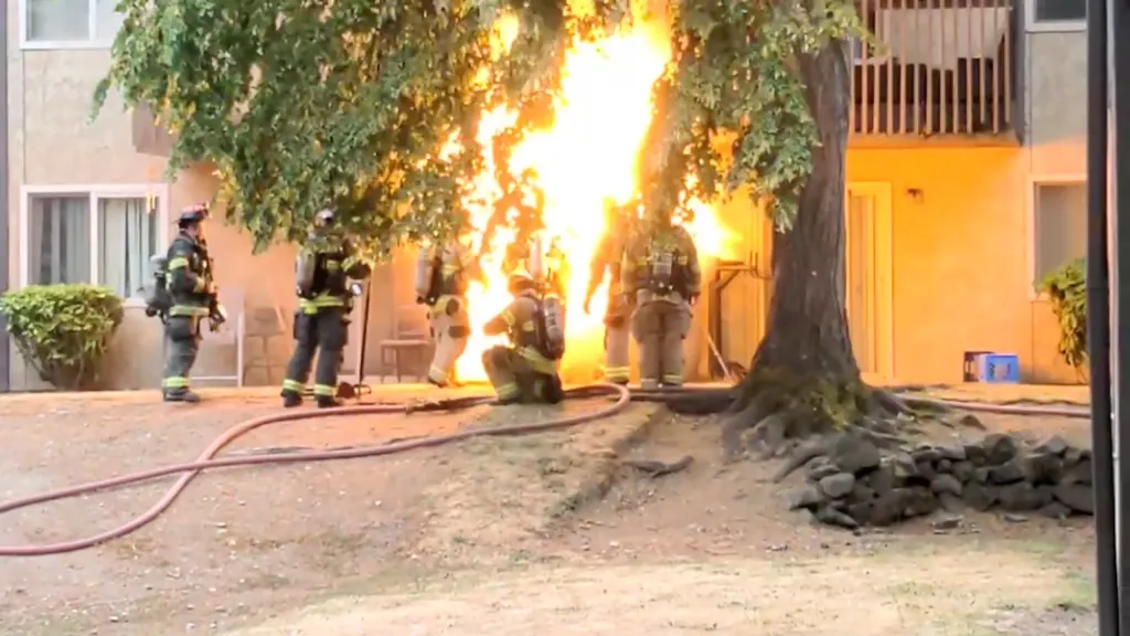 Firefighters responding to an apartment complex in Tacoma, Washington, are caught by an explosion.