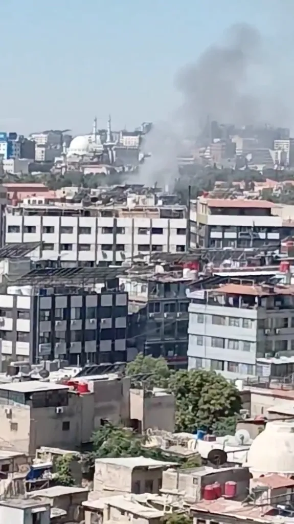 Smoke rising above buildings in Damascus after an explosion.