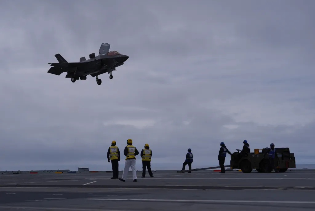 F-35B fighter jet prepares to land on the deck of HMS Prince of Wales.