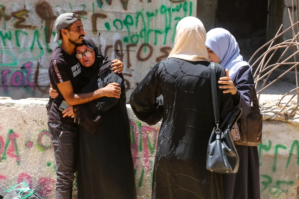 Family and friends mourn the death of a victim in Gaza.