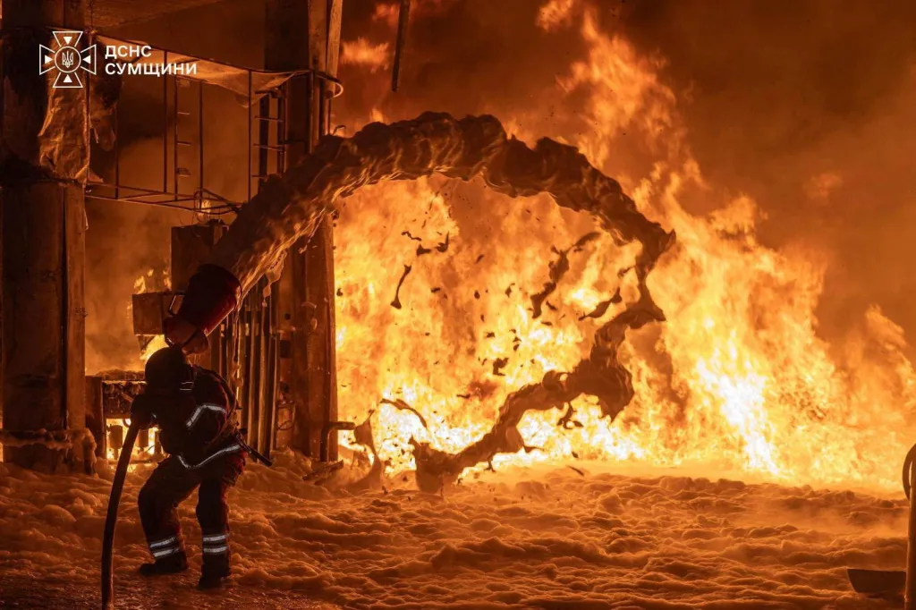 A firefighter works at the site of a petrol station hit by a Russian drone strike, amid Russia's attack on Ukraine, in Sumy, Ukraine, in this handout picture released July 23, 2026.