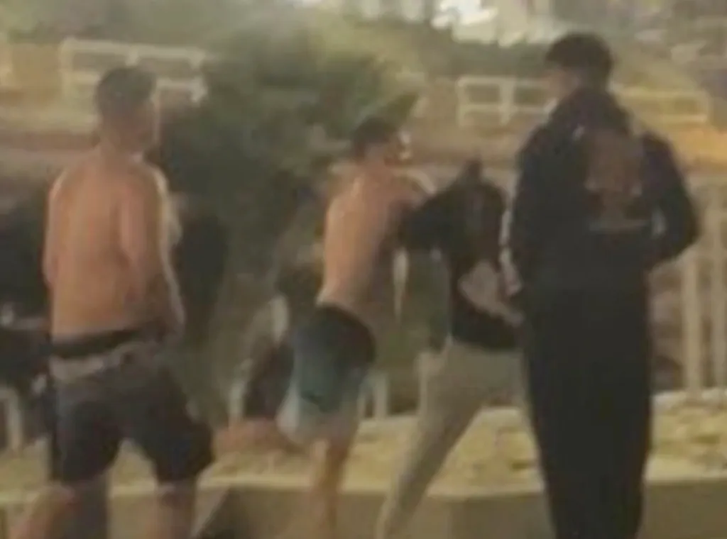 Two men attacking an Asian American man near Oceanside Pier.