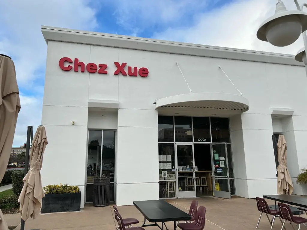 Exterior of Chez Xue restaurant with red lettering.