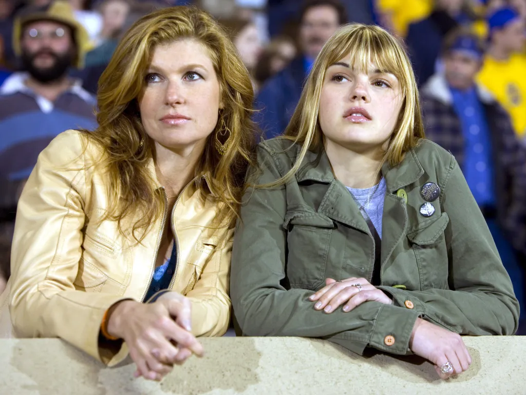 Connie Britton and Aimee Teegarden in a scene from Friday Night Lights.