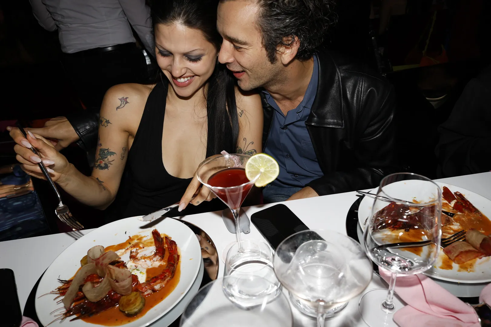 Gabbriette Bechtel and Matty Healy dining together at an event.