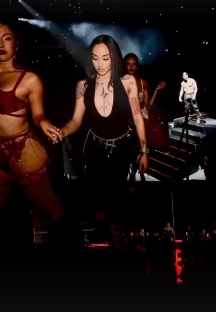 Gabrielle Cheyenne is led onstage at an Usher concert.