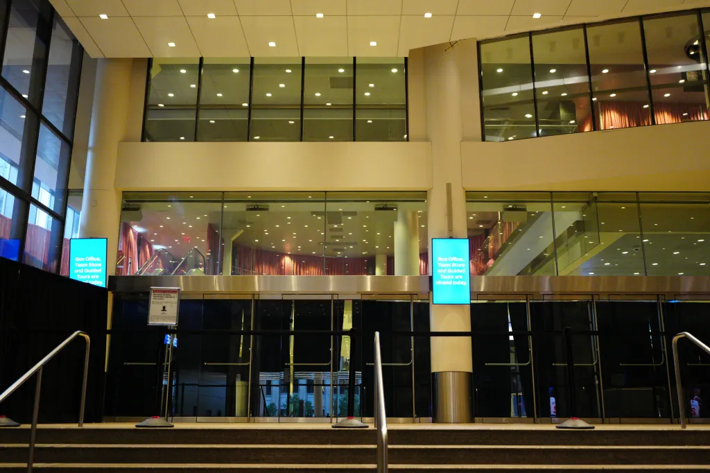 Madison Square Garden's interior with signs indicating the box office, team store, and guided tours are closed today.