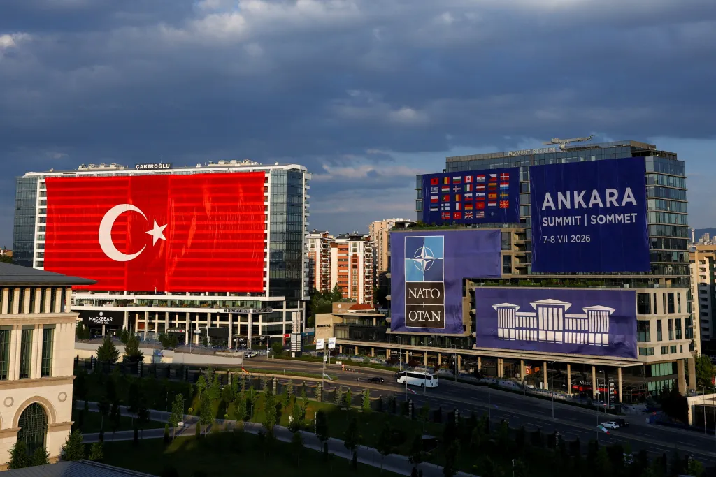 Buildings in Ankara, Turkey, displaying the Turkish flag and banners for the NATO Leaders' Summit.