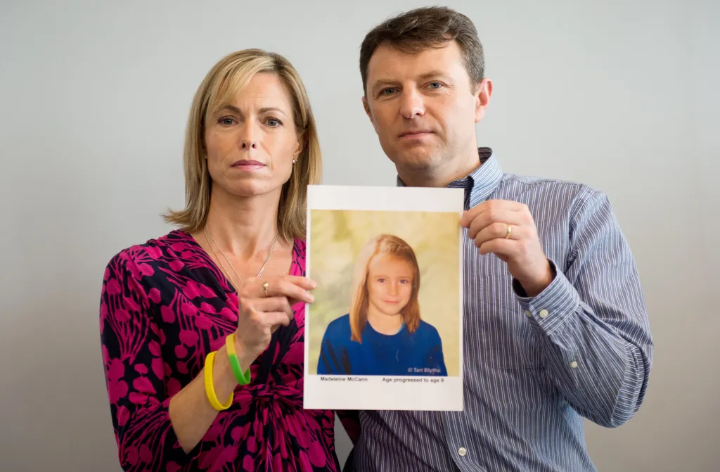 Kate and Gerry McCann hold an artist's impression of how their daughter Madeleine might look at age nine.