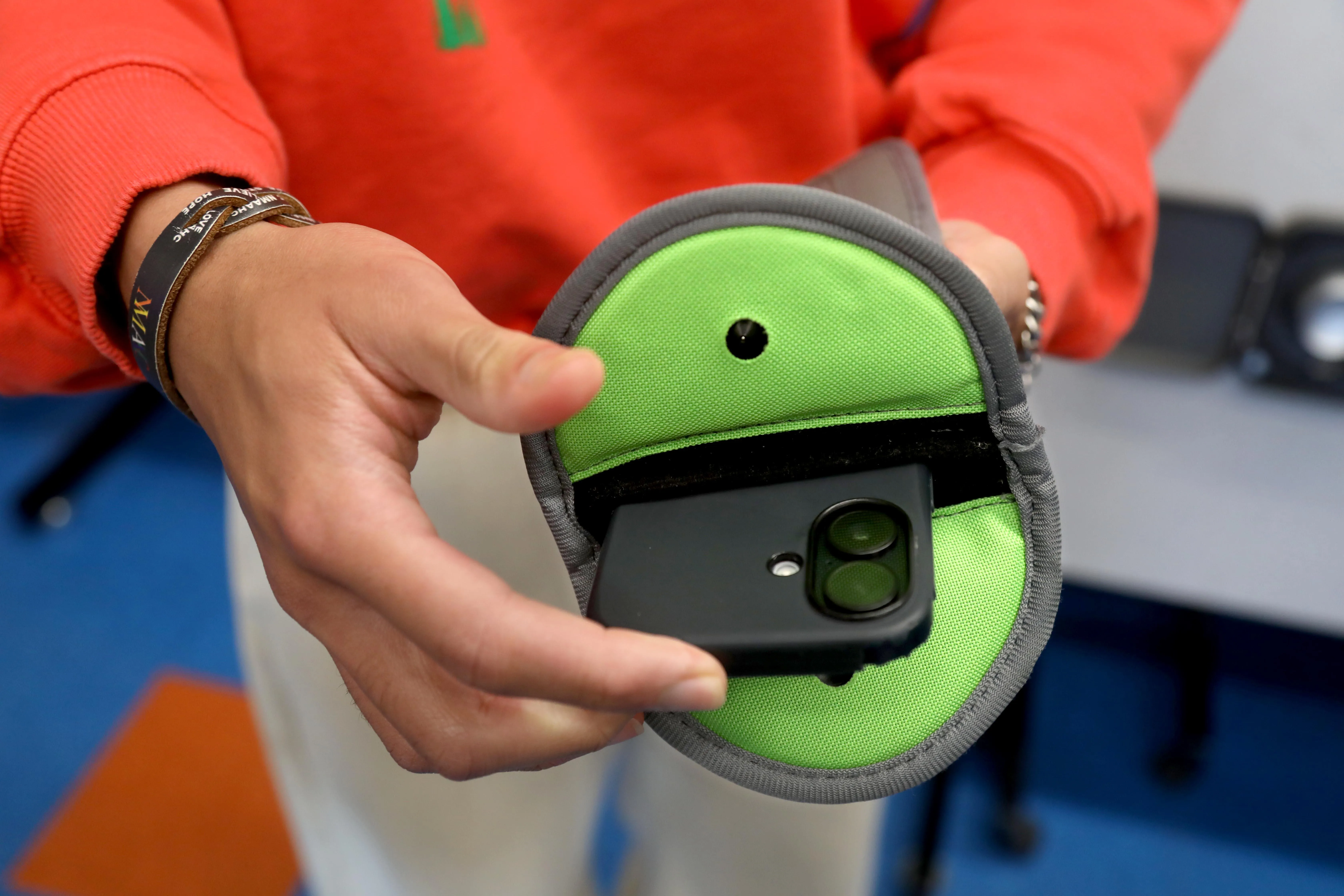 A student’s cell phone peeking out of a Yondr pouch