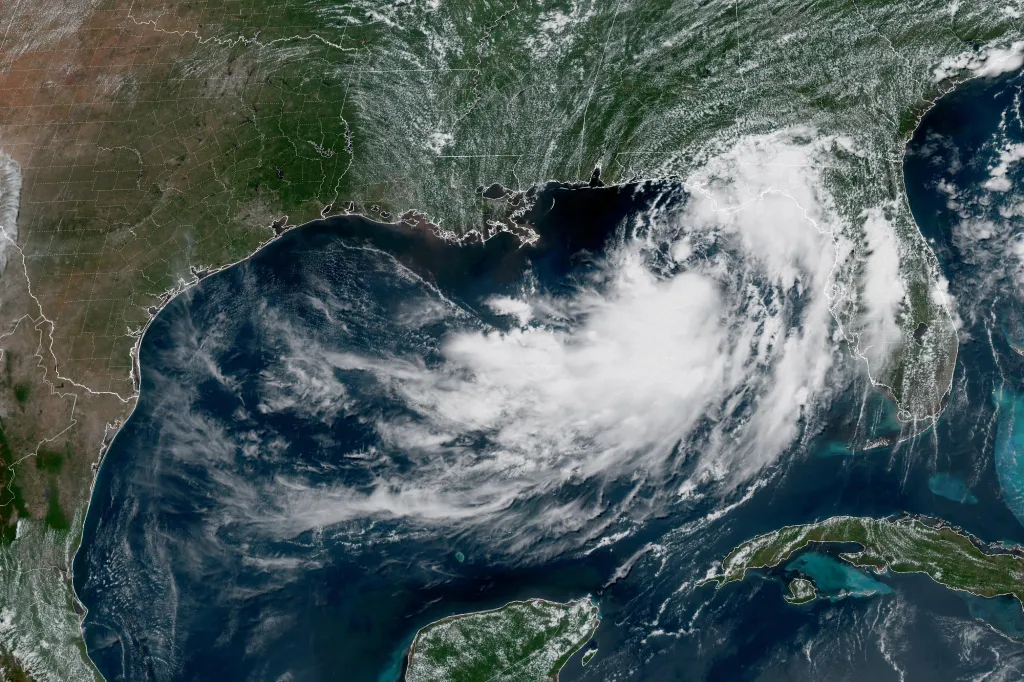 This GOES-19 GeoColor satellite image provided by NOAA shows a tropical depression in the Gulf of Mexico, Monday, July 20, 2026. 