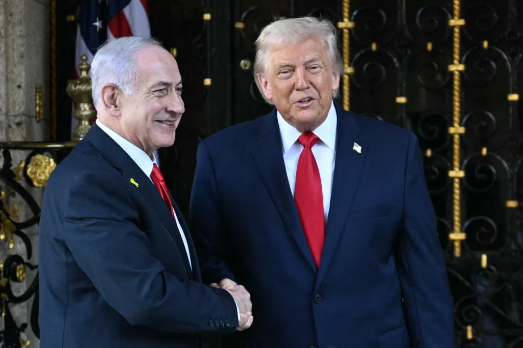 US President Donald Trump shakes hands with Israeli Prime Minister Benjamin Netanyahu.