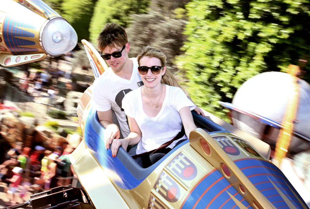 Chord Overstreet and Emma Roberts on the Astro Orbitor attraction at Disneyland.