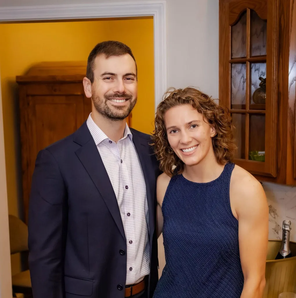 Hannah Rapp and her boyfriend, Dr. Will Pollalis, standing together and smiling.