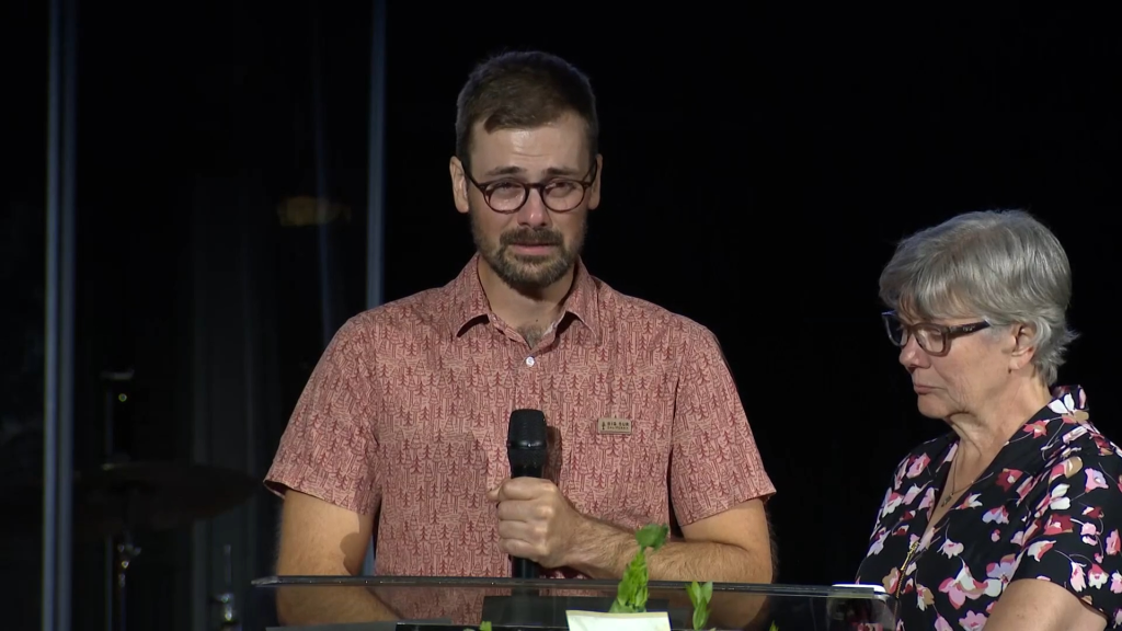 Dr. Will Pollalis, Hannah Rapp's boyfriend, tearing up while speaking at a memorial service.