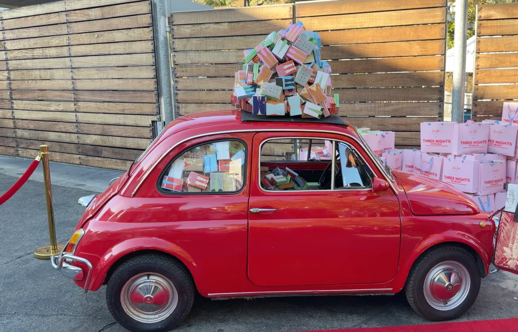 Red car decorated with gift boxes at the Hollywood Bowl.