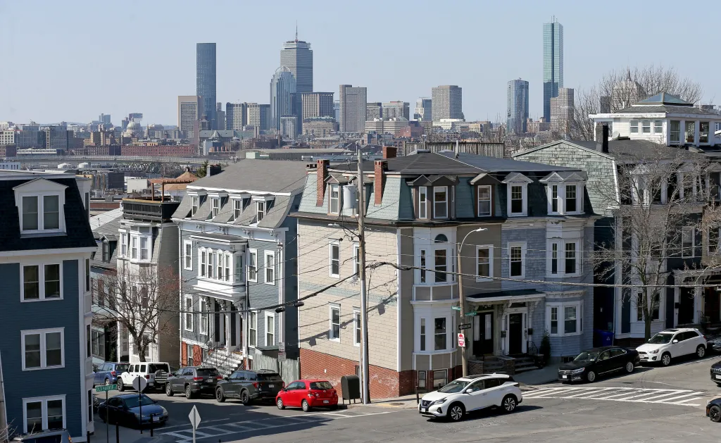 Homes in South Boston seen from Dorchester Heights, with the city skyline in the background.