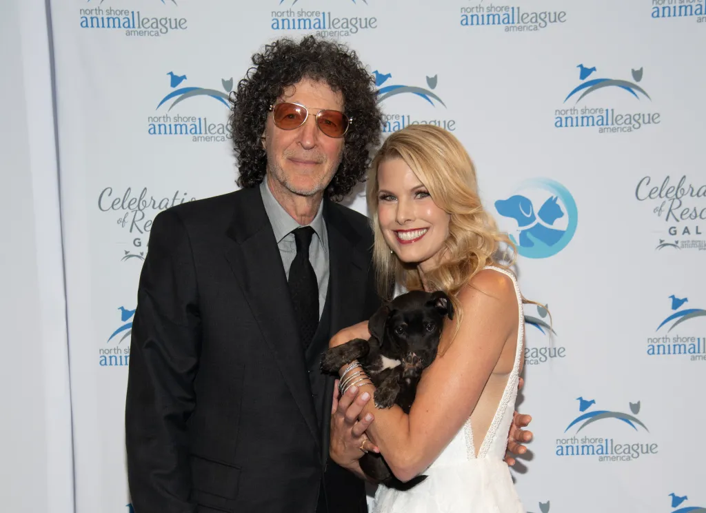 Howard Stern and Beth Ostrosky Stern holding a puppy at the 2025 North Shore Animal League America Celebration of Rescue.