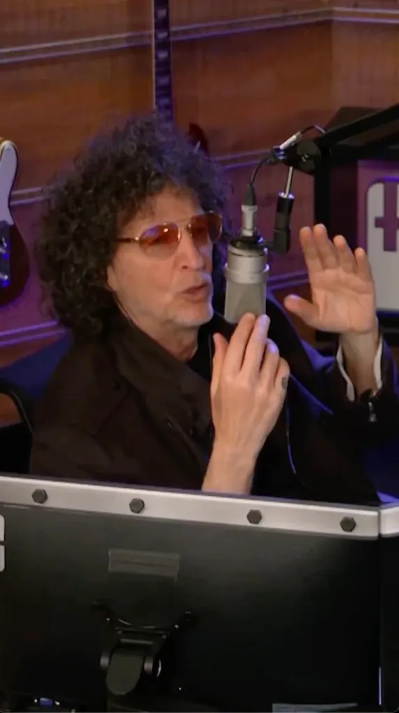 Howard Stern speaking into a microphone.