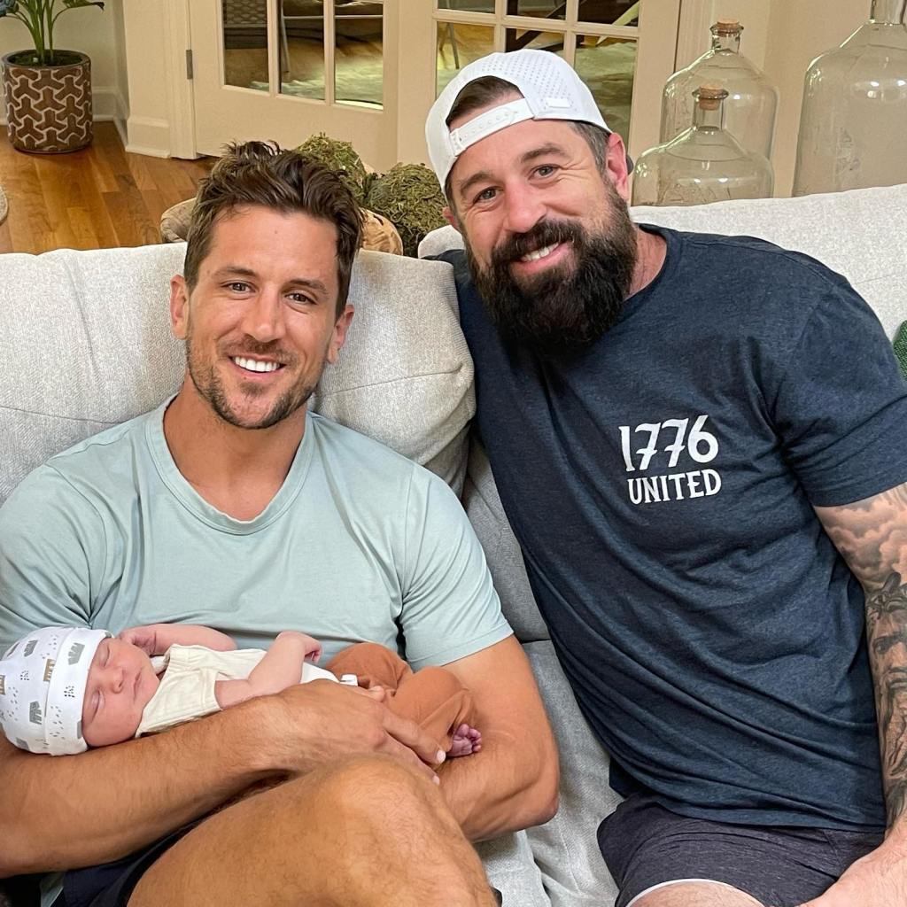 Jordan and Luke Rodgers posing with a baby.