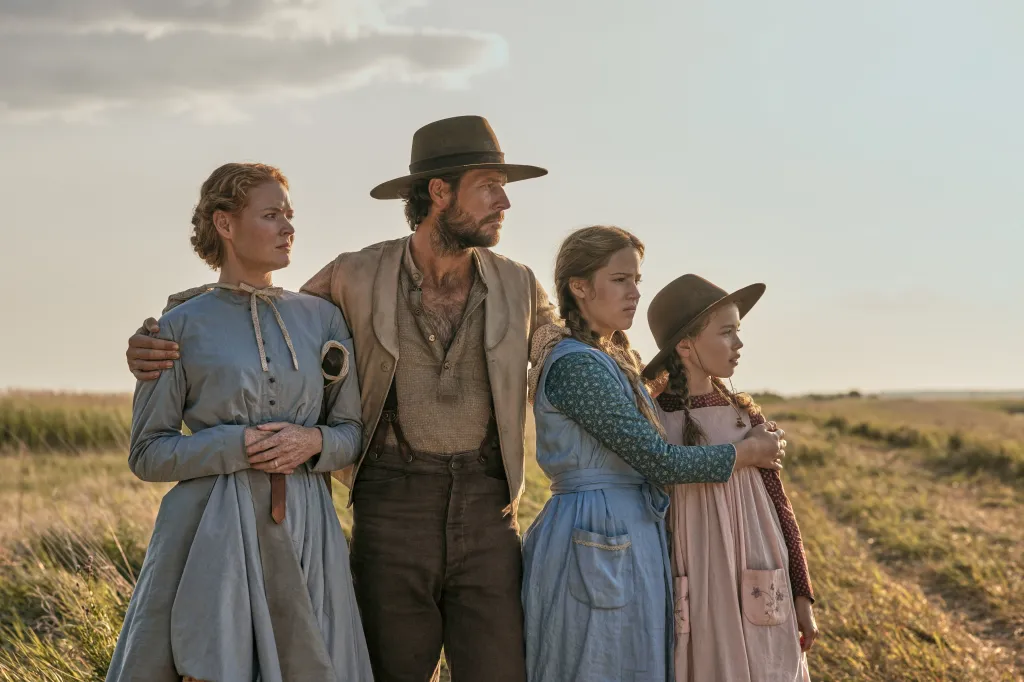The Ingalls family from "Little House on the Prairie" looking off into the distance.