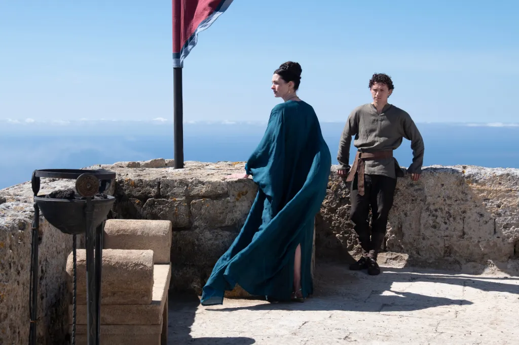 Anne Hathaway as Penelope and Tom Holland as Telemachus in a scene from "The Odyssey."