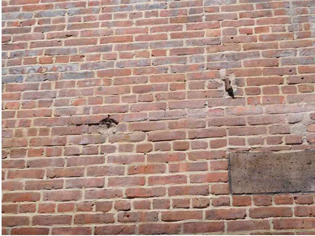 Court records also show an image of allegedly damaged masonry.