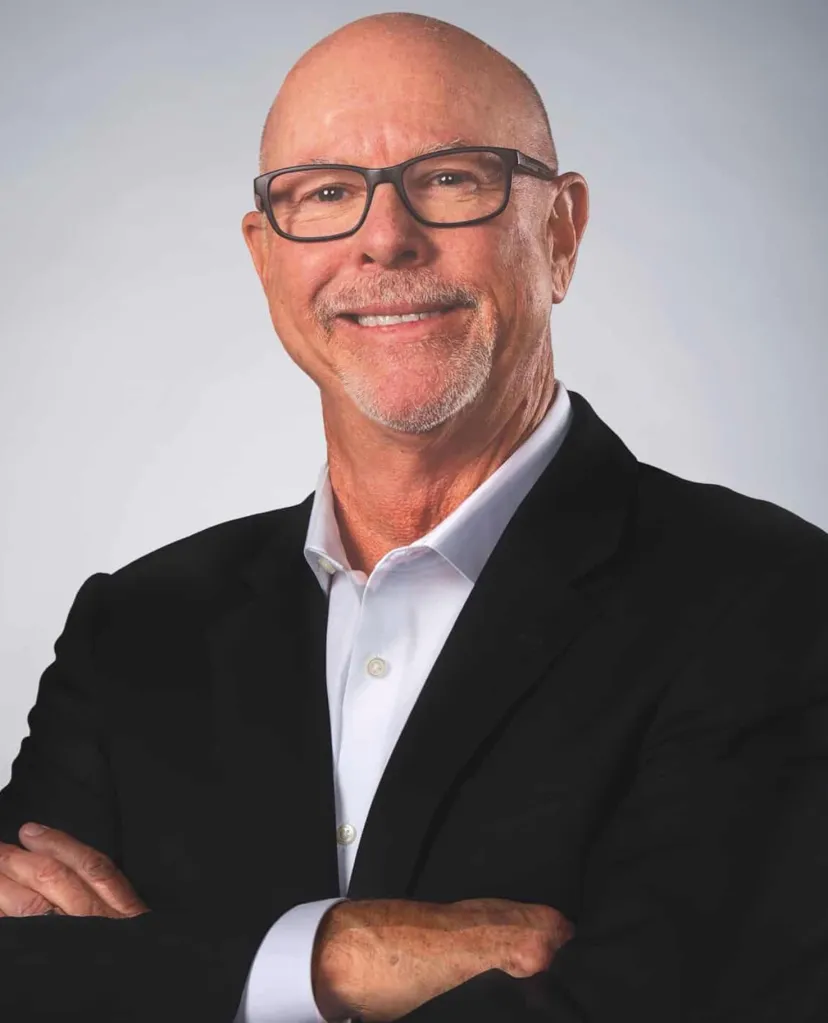Brian Doyle, CEO of Infill Innovations, smiling with arms crossed.