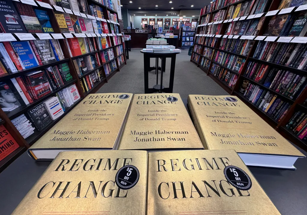 Copies of "Regime Change: Inside the Imperial Presidency of Donald Trump" displayed in a bookstore.