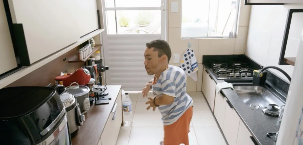 The kitchen saw the biggest transformation, swapping tall cupboards for pull-out drawers and open shelves, plus a custom shallow sink and a lowered stovetop that let them cook together comfortably.