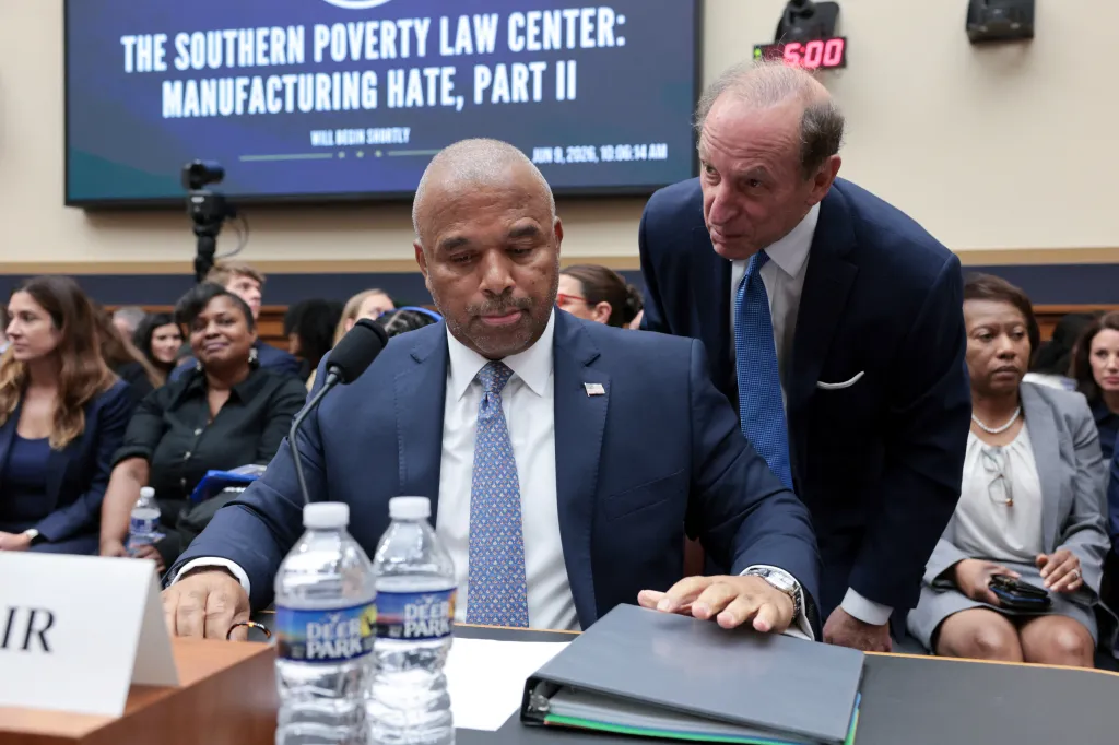 Southern Poverty Law Center Interim President Bryan Fair listens to attorney Abbe Lowell before testifying at a U.S. House Judiciary Committee hearing.