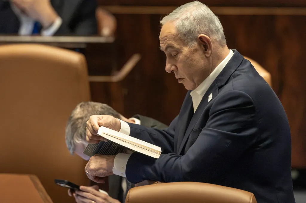 Israel's Prime Minister Benjamin Netanyahu reads a book at the Knesset.