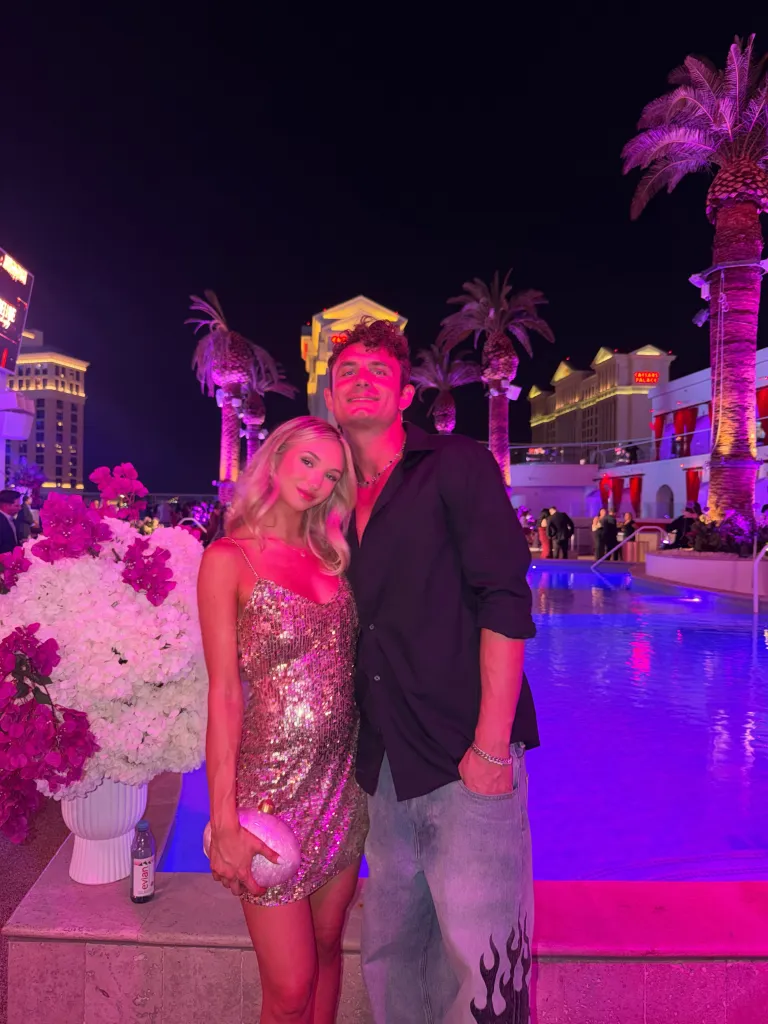 James Kennedy and Jordan Meyers posing at a poolside party.
