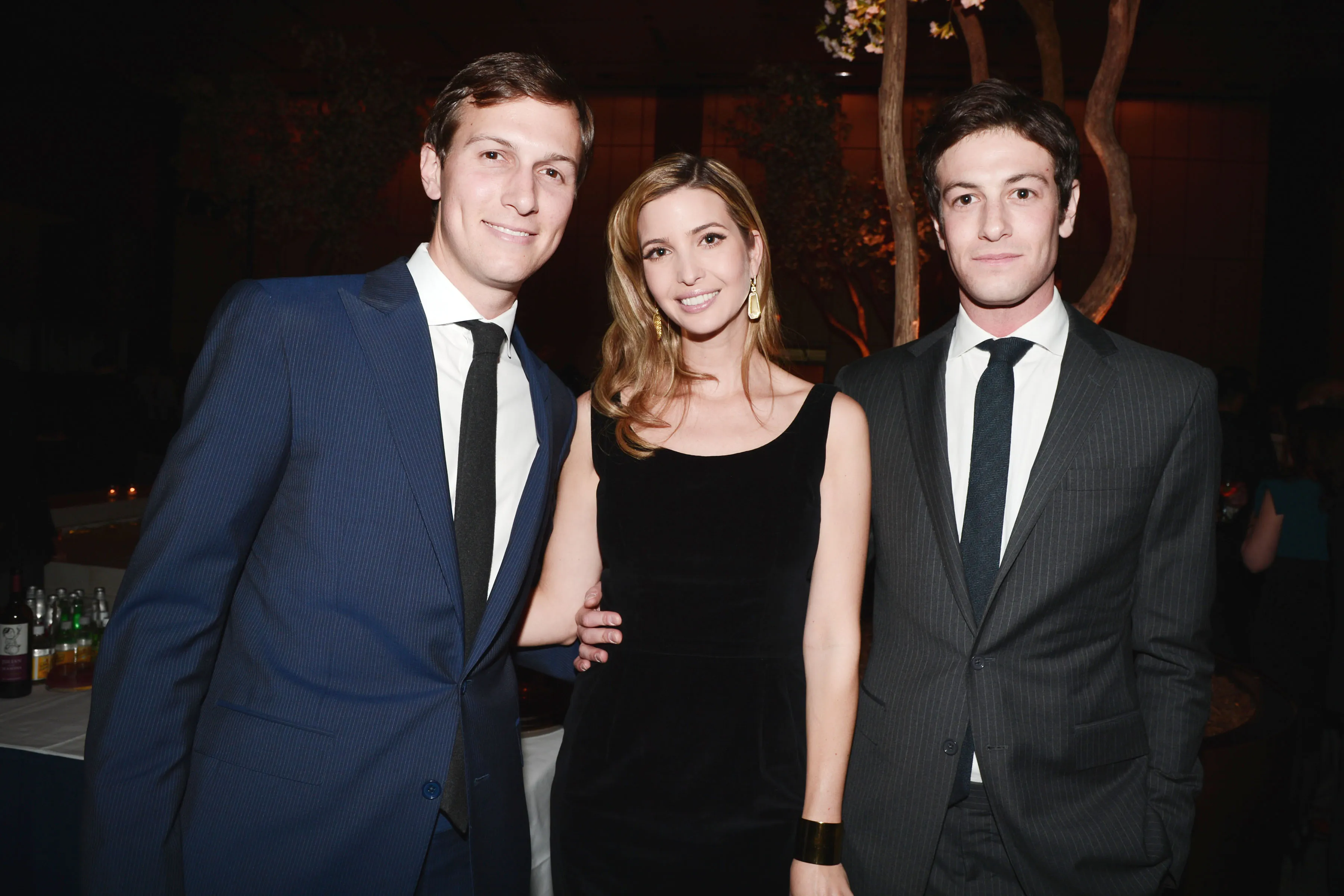 Jared Kushner, Ivanka Trump, and Joshua Kushner posing for a photo.