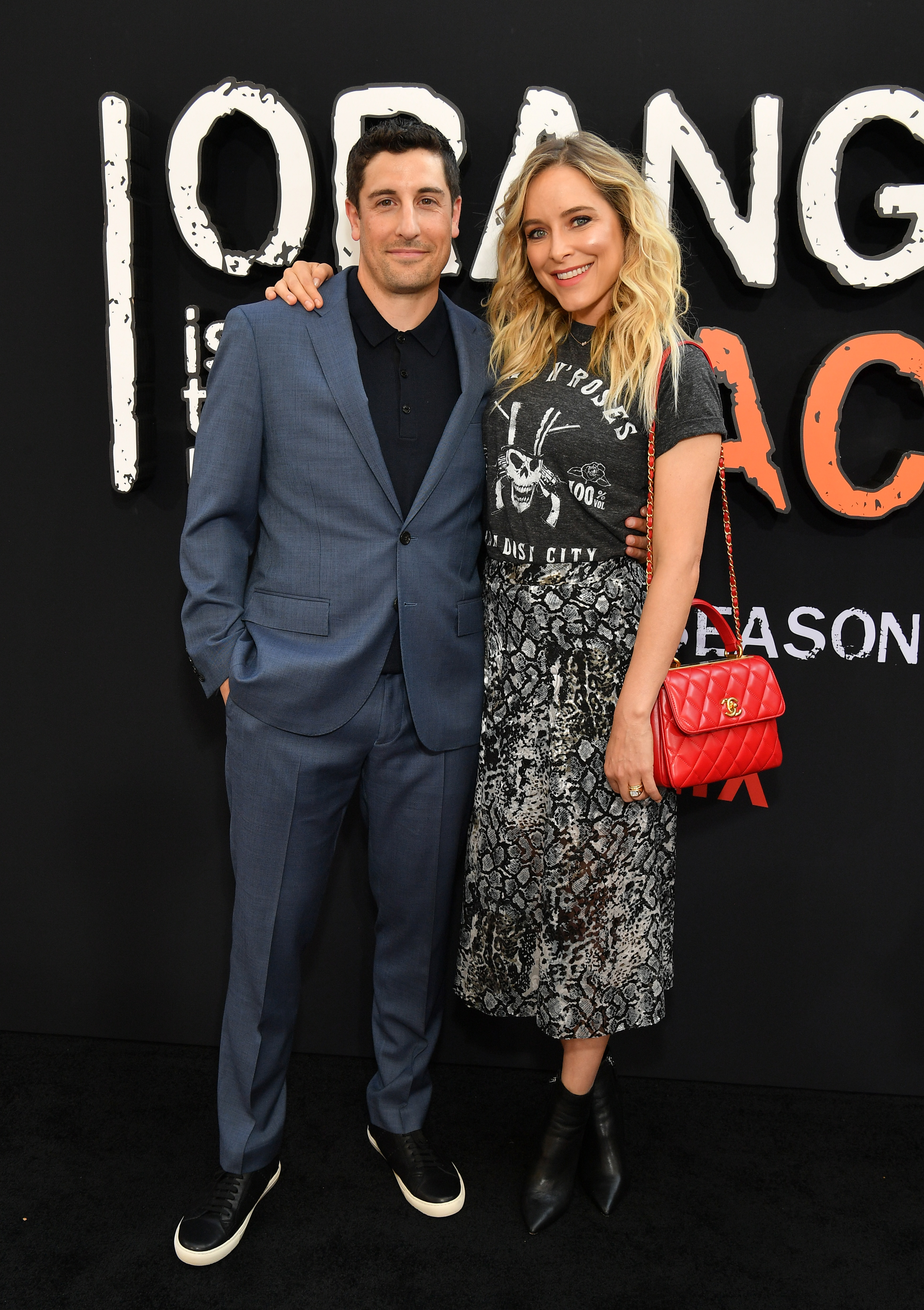 Jason Biggs and Jenny Mollen pose together at the "Orange is the New Black" Season 7 premiere.