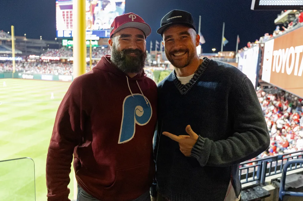 Jason and Travis Kelce pose for a photo during Game 1 of the NLCS.