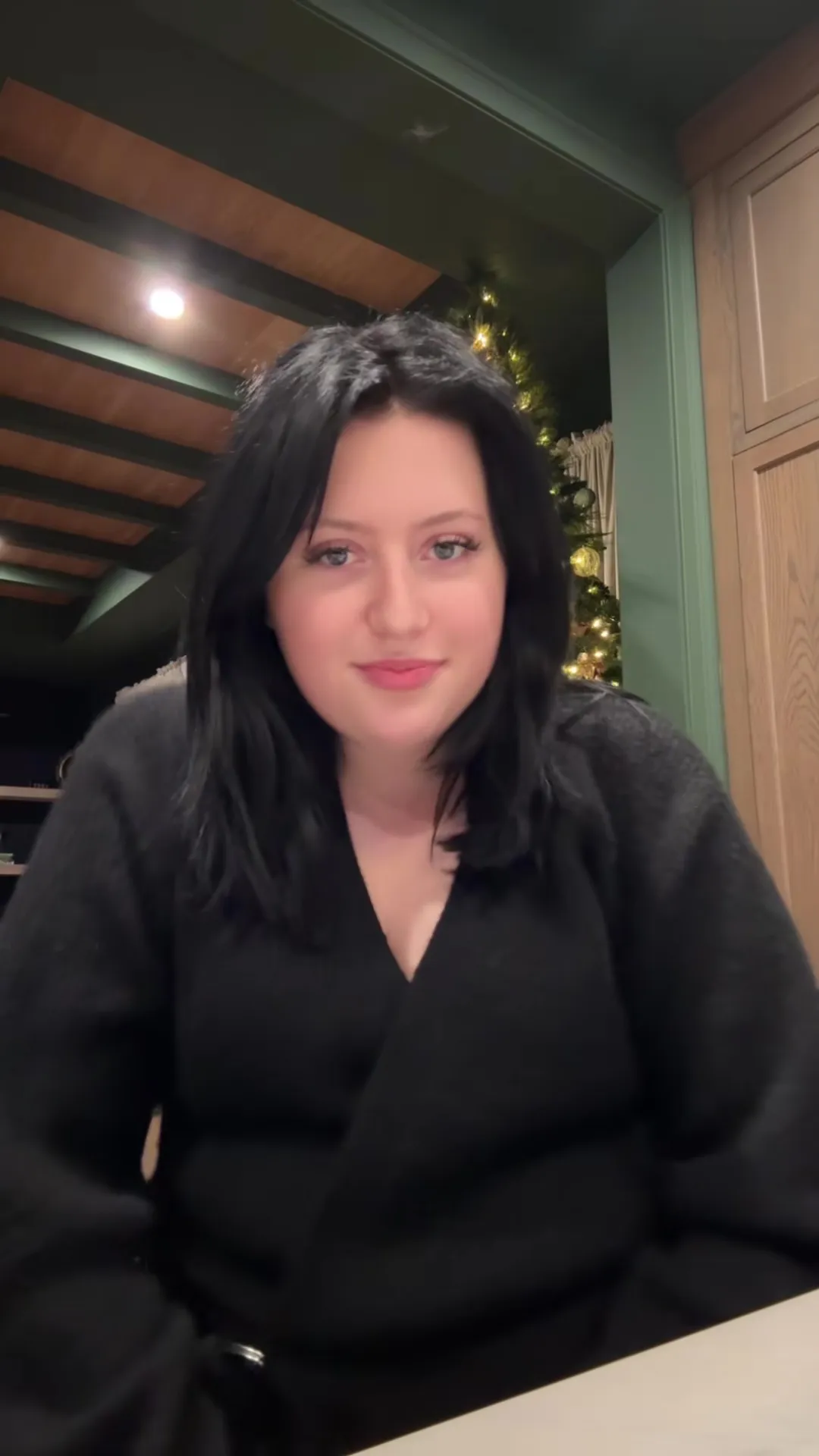 Bailee Ann DeFord, an 18-year-old with dark hair and blue eyes, wearing a black top.