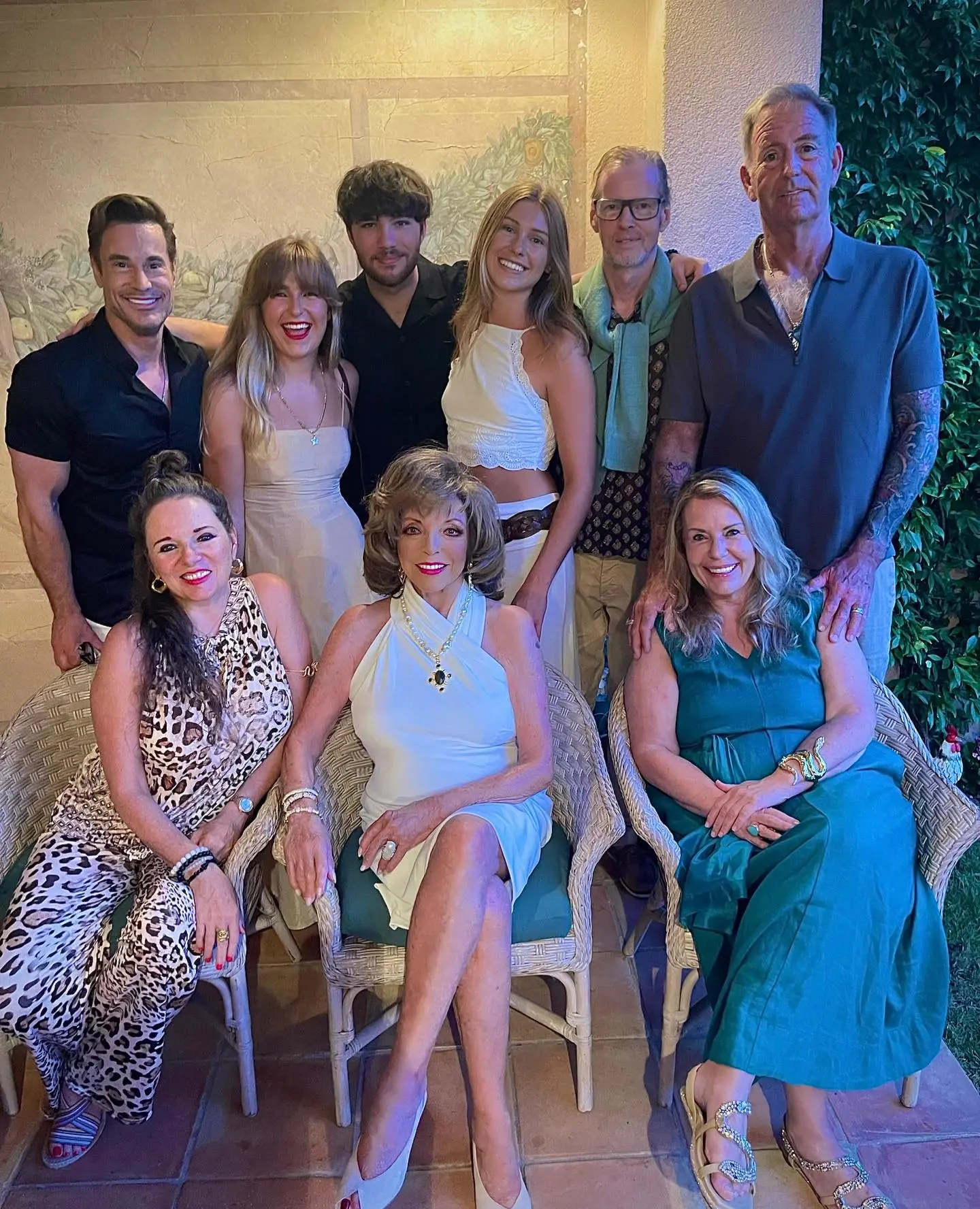 Joan Collins with Alison Papworth and a group of friends.