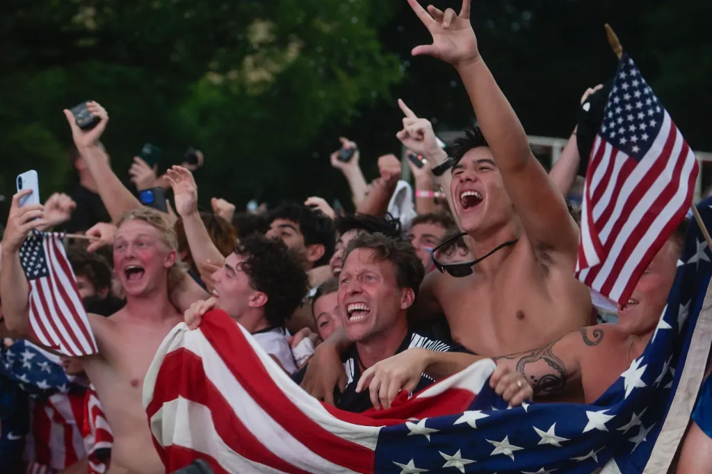 John TenBrink and other fans react to the first goal by the United States during a World Cup watch party.