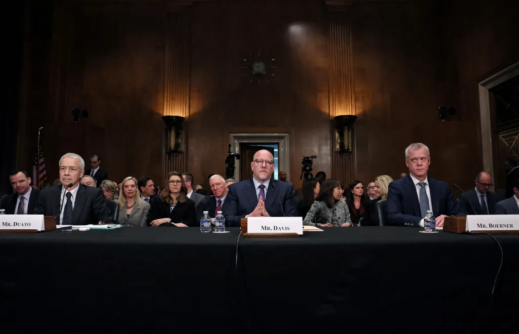 FILE PHOTO: Johnson & Johnson CEO Joaquin Duato, Merck CEO Robert Davis, and Bristol Myers Squibb CEO Chris Boerner testify before a Senate Health, Education, Labor, and Pensions Committee hearing on high drug prices on Capitol Hill in Washington, on Feb. 8, 2024. 