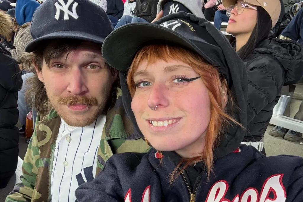 Kaitlyn E. Tracey, accused of assault, and an unidentified man wearing Yankees hats.