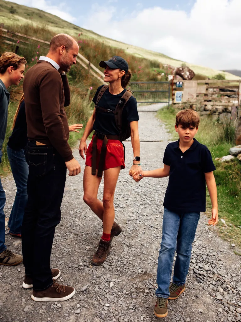 Kate Middleton posing with her three children.