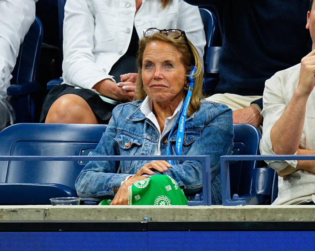Katie Couric watching the US Open Tennis Championships.