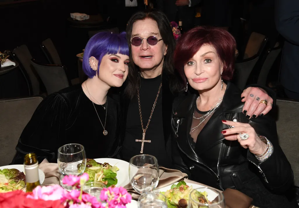 Kelly Osbourne, Ozzy Osbourne, and Sharon Osbourne pose together at the Pre-GRAMMY Gala.