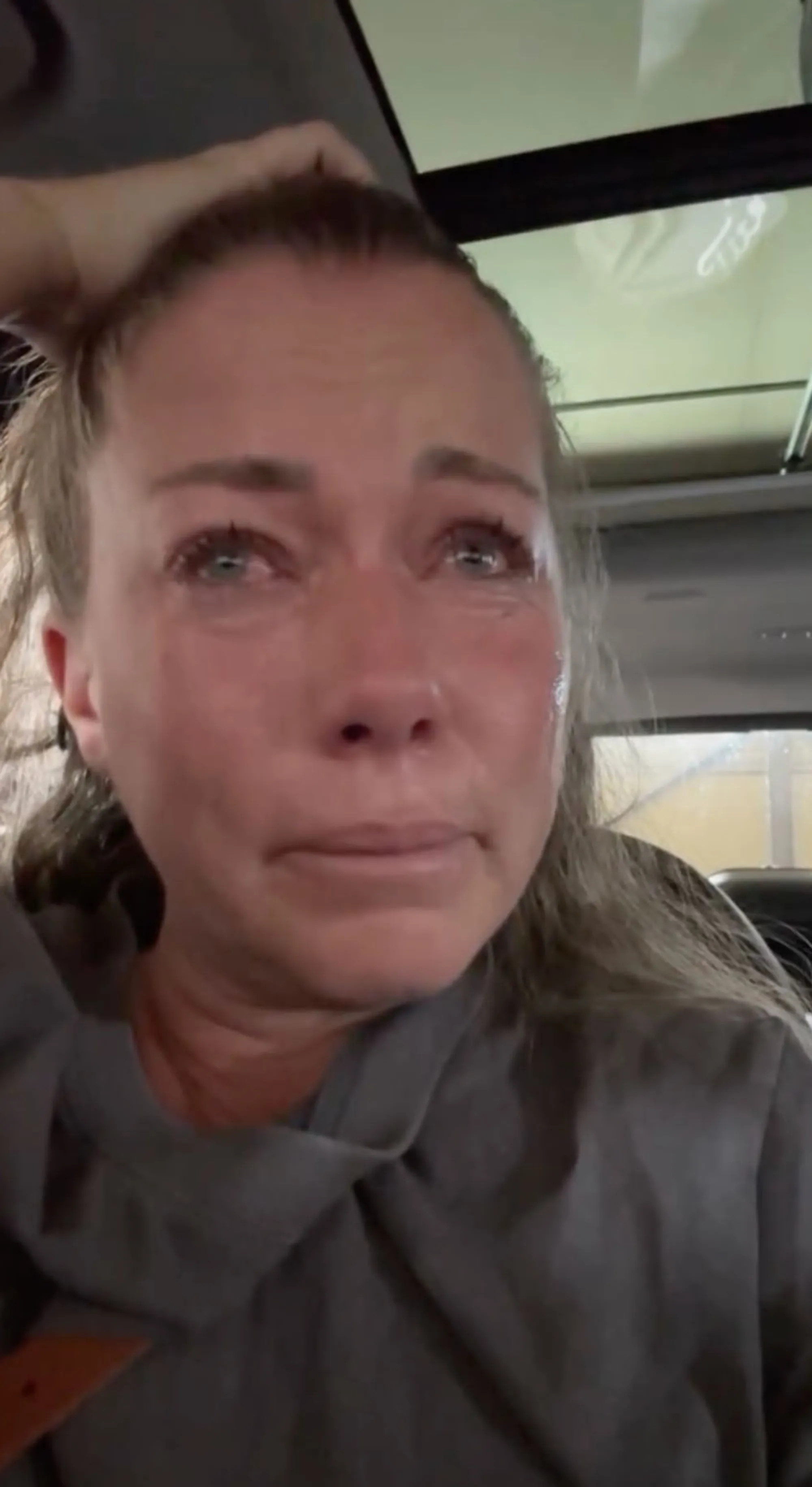 Kendra Wilkinson crying in a close-up selfie.