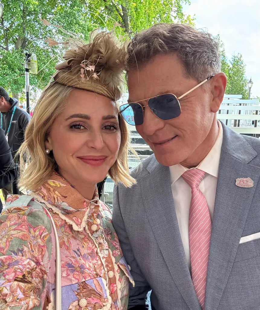 Brooke Williamson and Bobby Flay smiling.