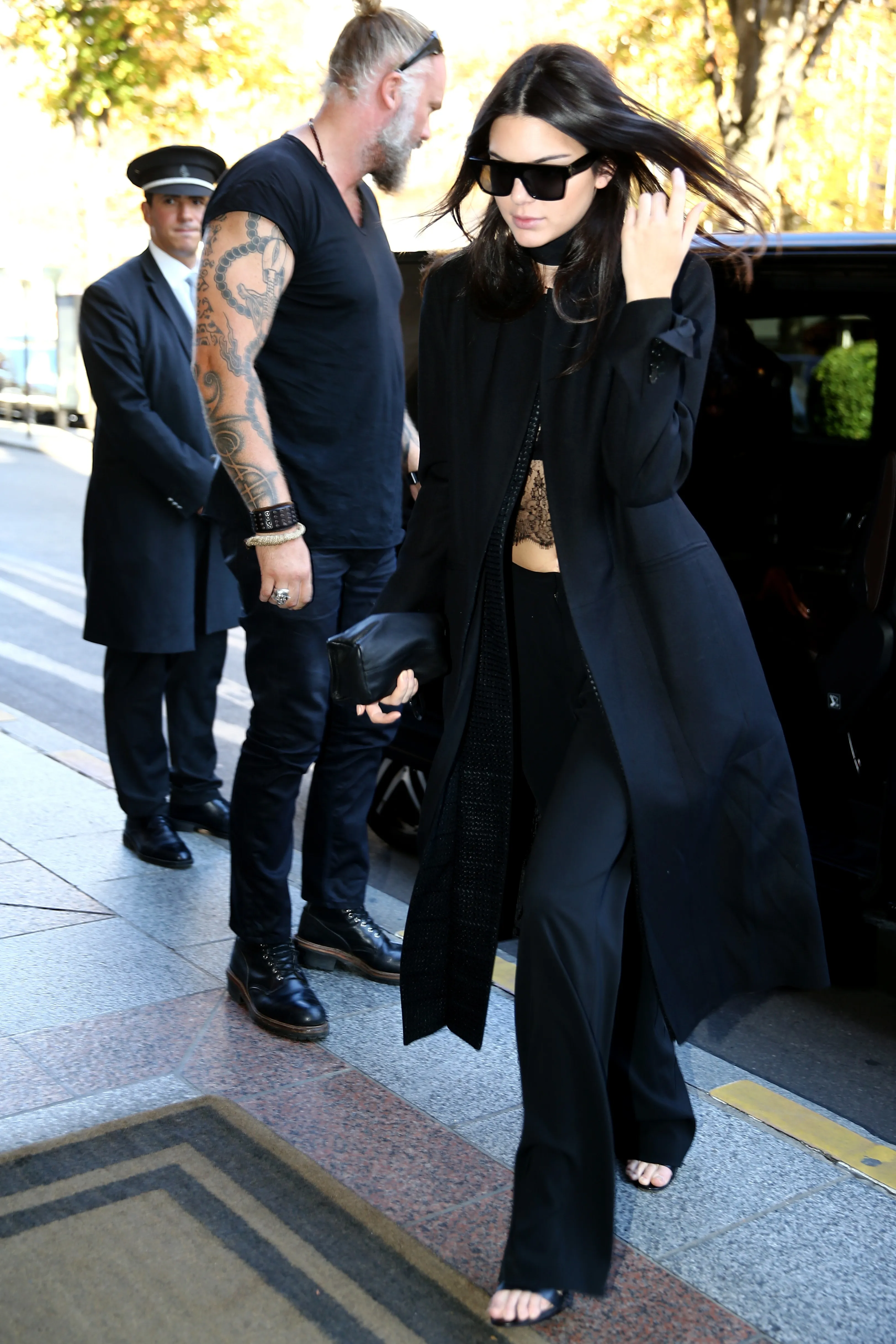 Kendall Jenner arriving in a black outfit to a hotel during Paris Fashion Week.