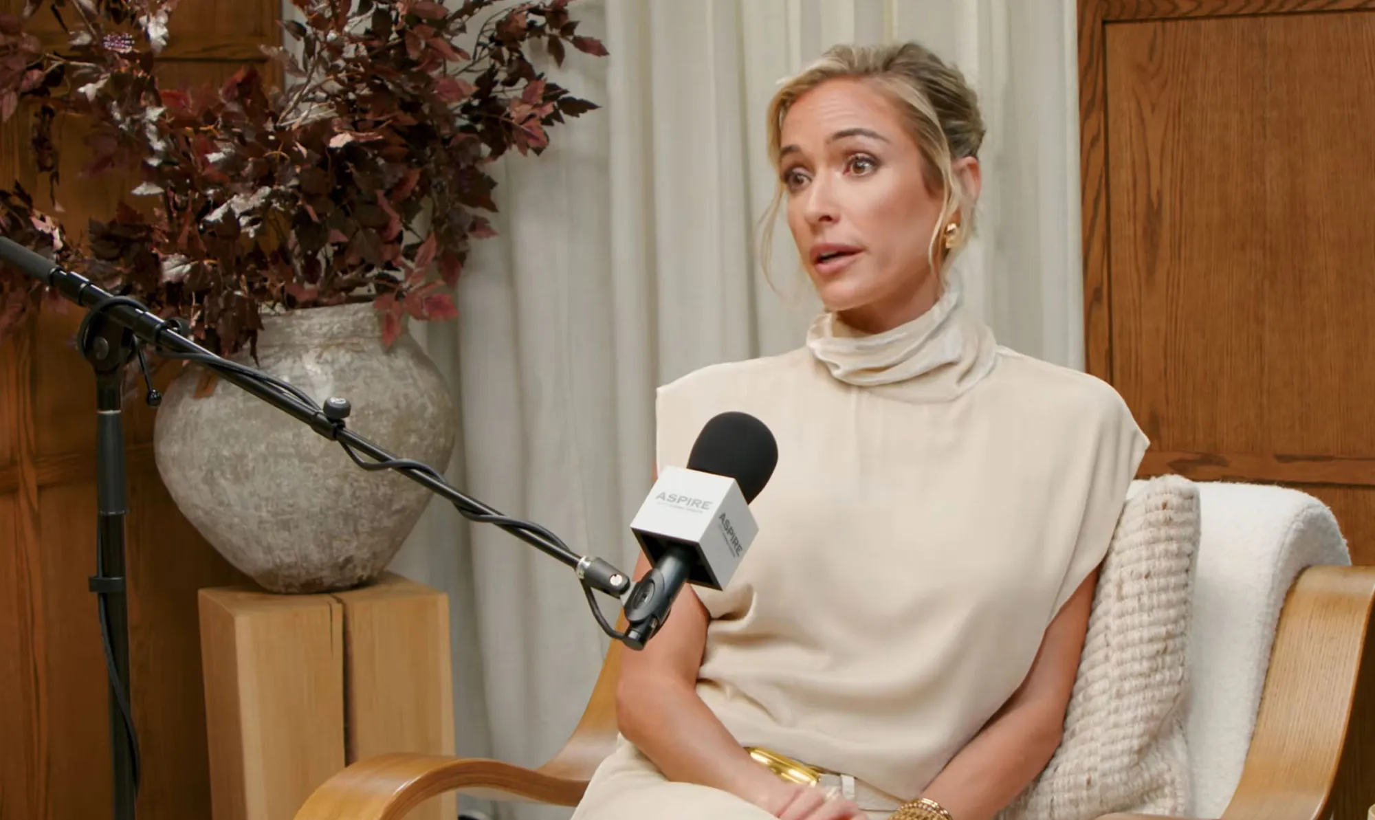 Kristin Cavallari speaking into a microphone.