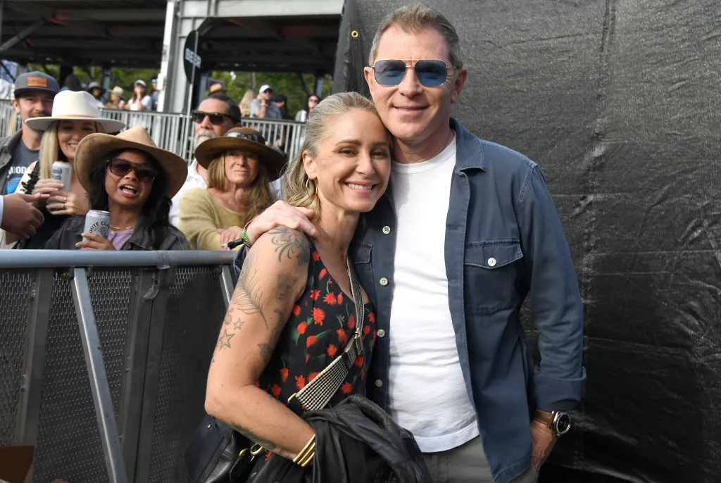 Brooke Williamson and Bobby Flay smile for a photo at the Bottle Rock Napa Valley festival.