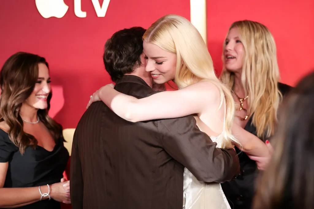 Jonathan Tropper and Anya Taylor-Joy embracing on the red carpet at the premiere of Apple TV's